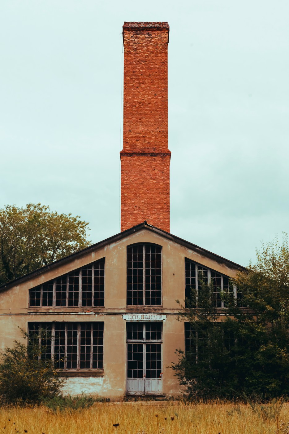 An old industrial smokestack, typical of Troy's manufacturing past